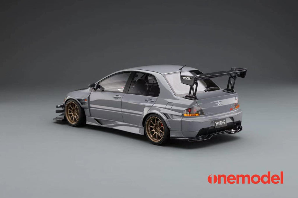 One Model 1:18 Mitsubishi Lancer Evolution IX Voltex with Carbon Bonne